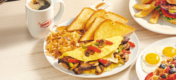 Denny's Philly Cheesesteak Omelette with Cup of Coffee