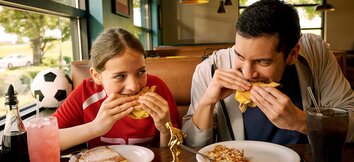 Family Enjoying Denny's