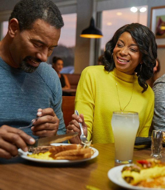 Couple enjoying a meal at Denny's
