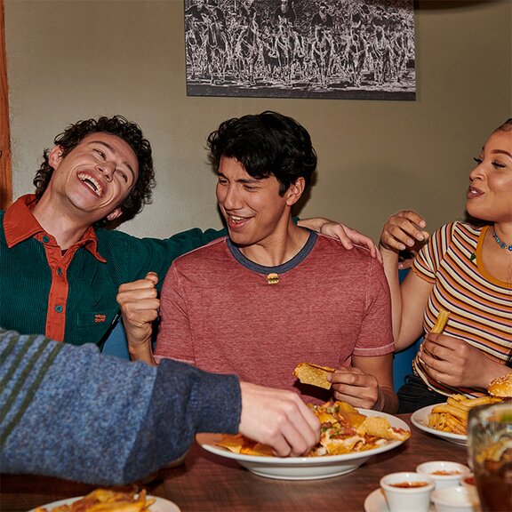 3 teenagers eating at Denny's